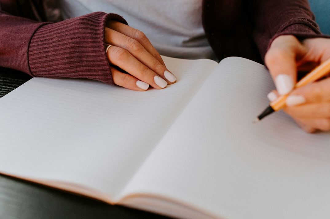 woman writing in journal
